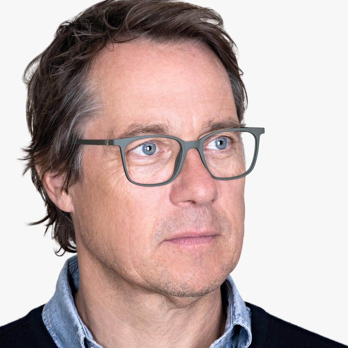 Person wearing Fyn Dark Army glasses