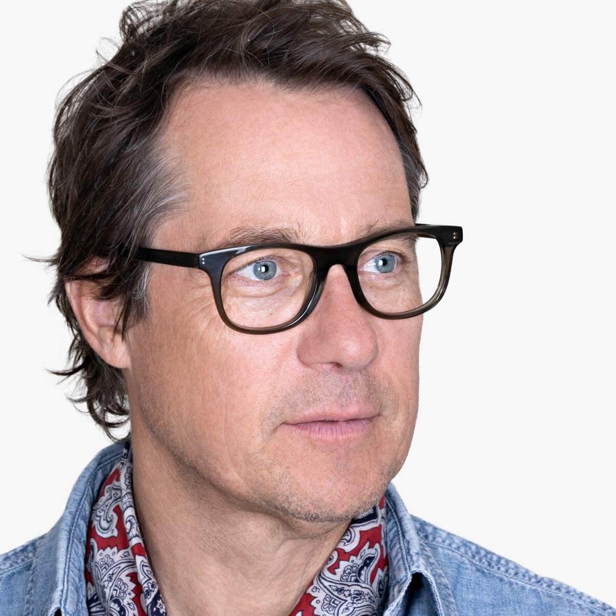 Person wearing Men's Malmö Shiny Olive glasses