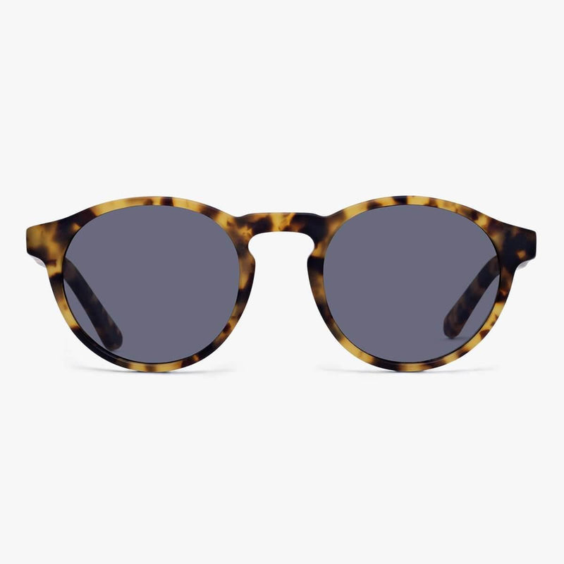 Tortoise shell sunglasses with round frames and dark lenses