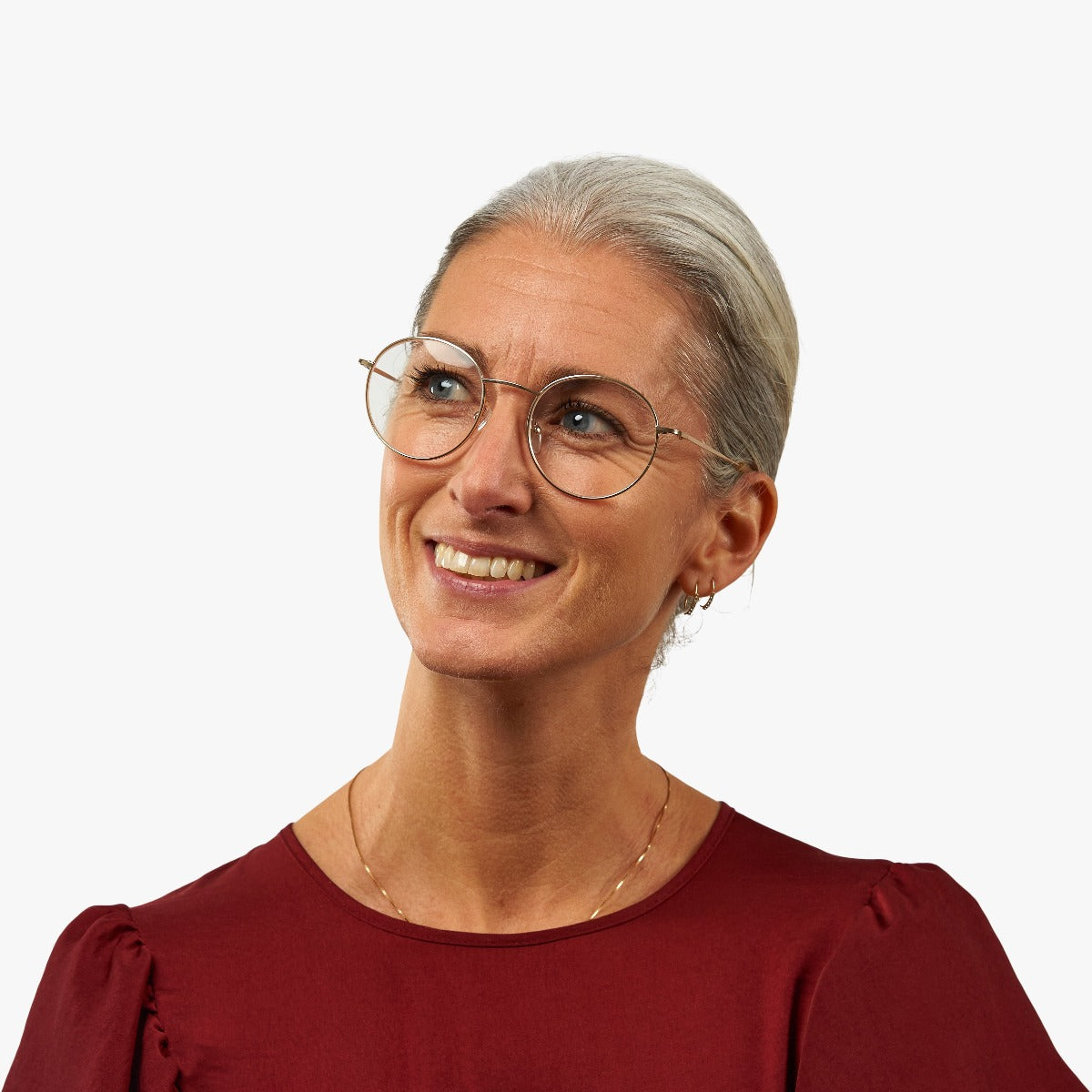 Person wearing Women's Tromsø Gold round frame glasses